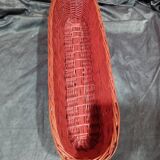 Old bread basket for baguette or red banneton in woven wicker