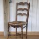 Antique chair with coloured rush seating.