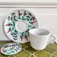 Antique herbal tea cup with mint infusion