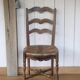 Antique chair with coloured rush seating.