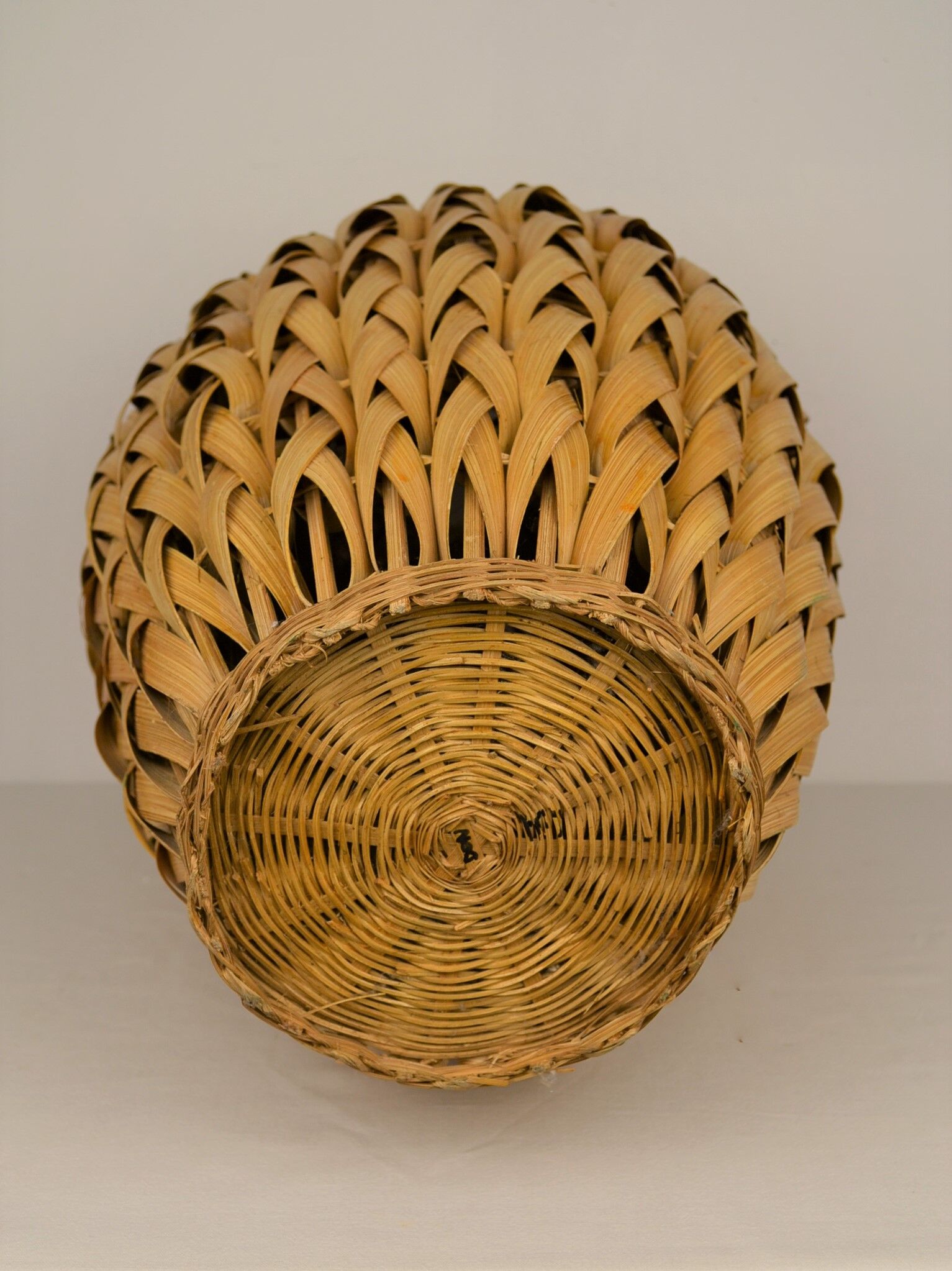 Rattan vase and braided bamboo leaves