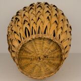 Rattan vase and braided bamboo leaves