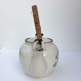 Vintage teapot with wicker handle