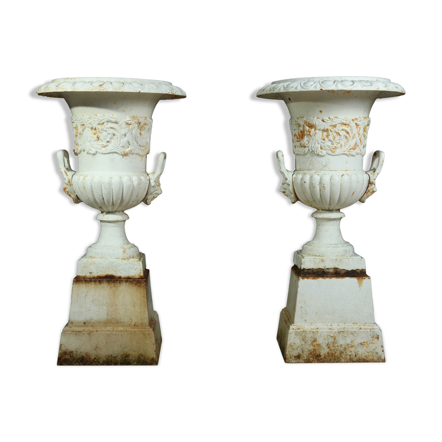 Pair of cast iron urns on plinth