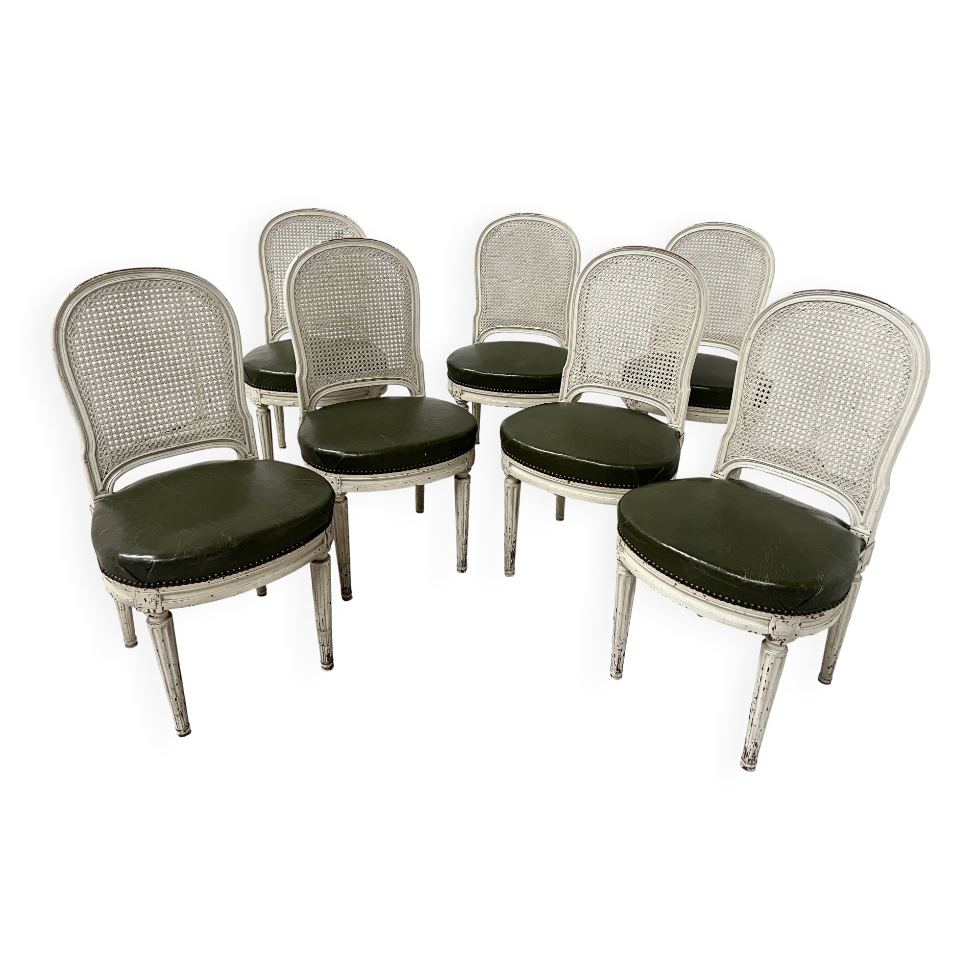 Set of seven Louis XVI style chairs in patinated beech, 20th century.