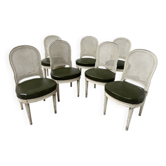Set of seven Louis XVI style chairs in patinated beech, 20th century.