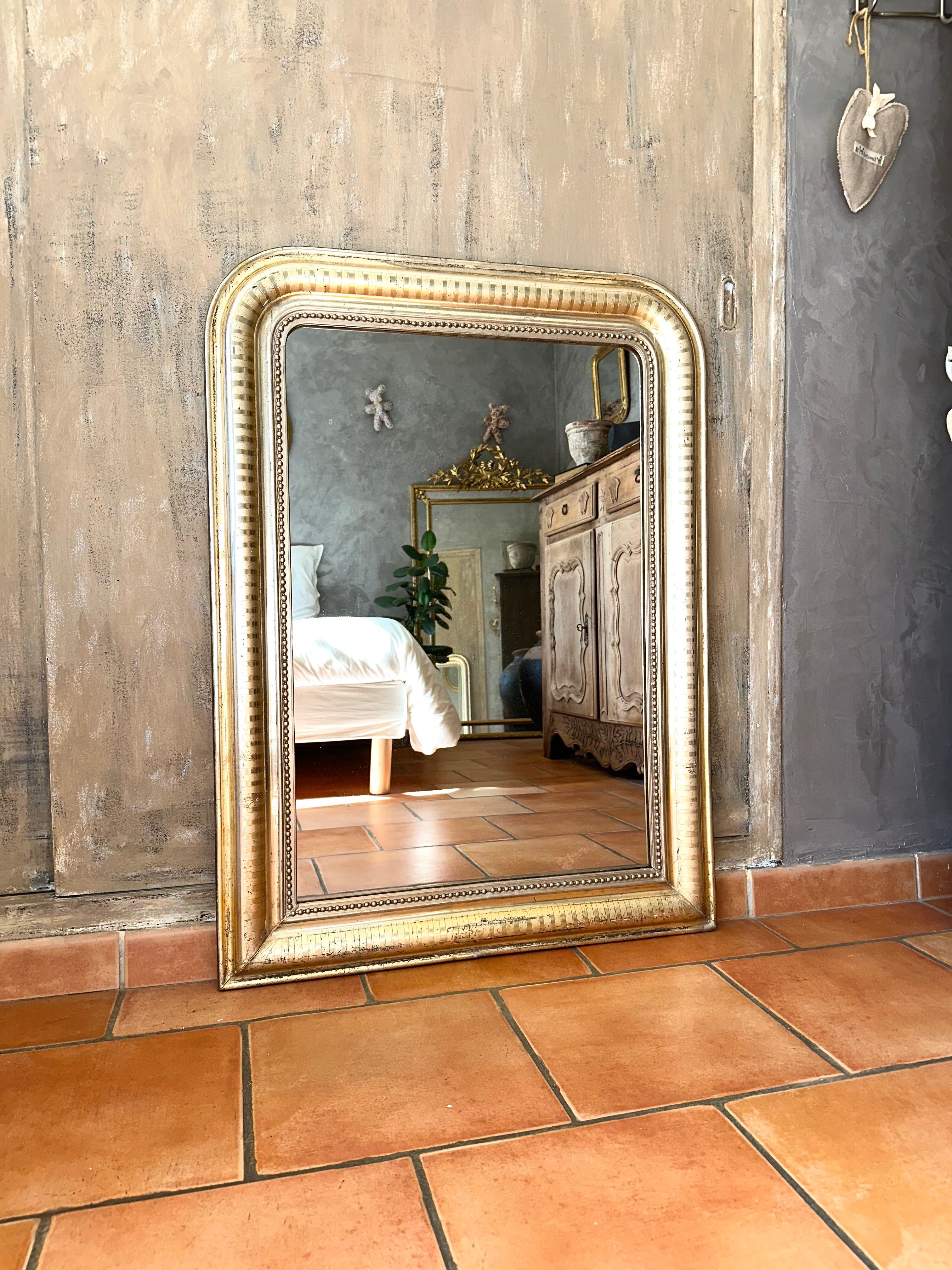 Louis-Philippe antique mirror with silver leaf, 19th century.