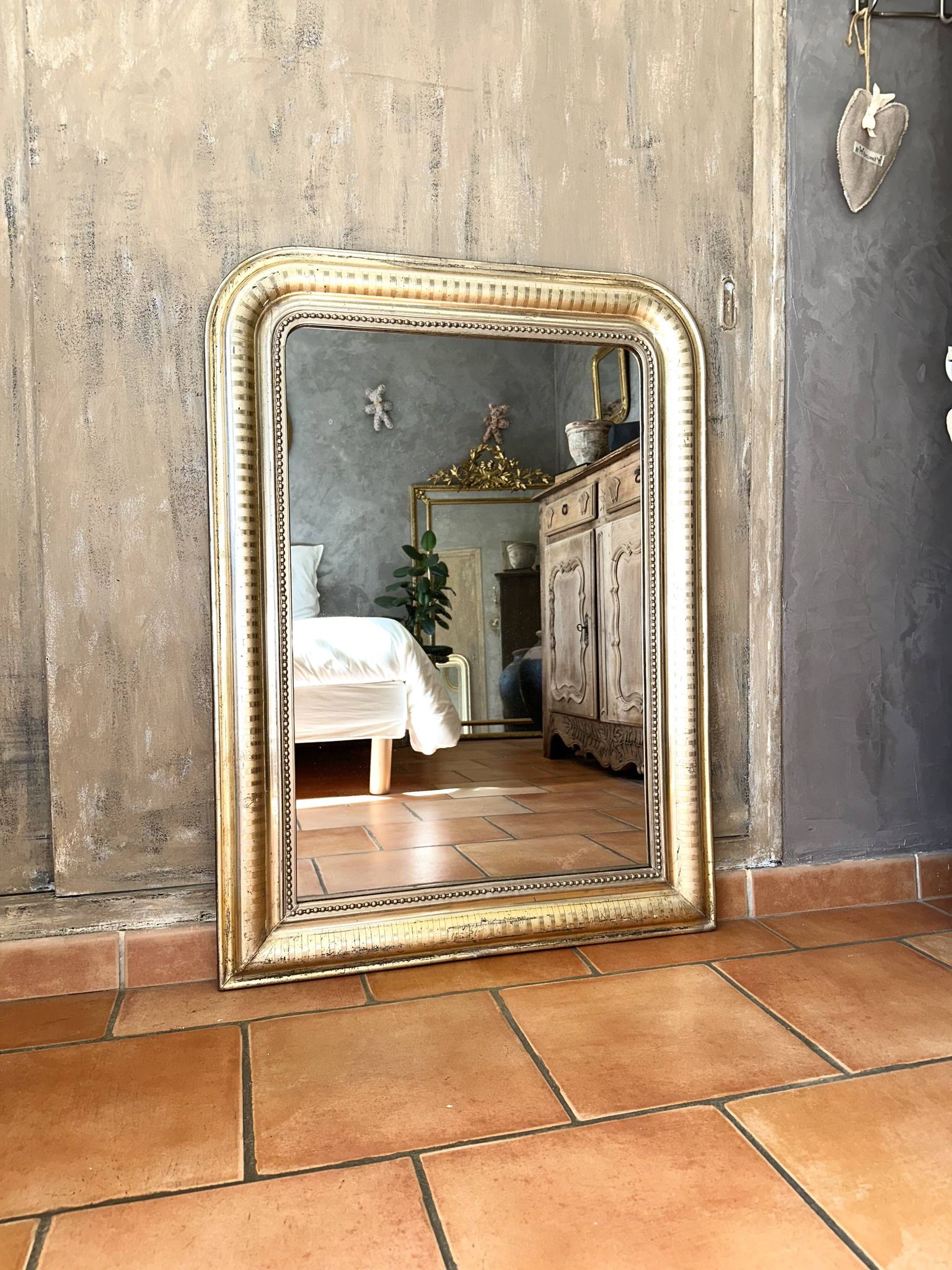 Louis-Philippe antique mirror with silver leaf, 19th century.