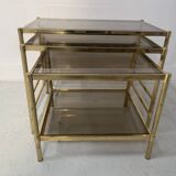 Set of three nesting tables in brass and smoked glass, 20th century