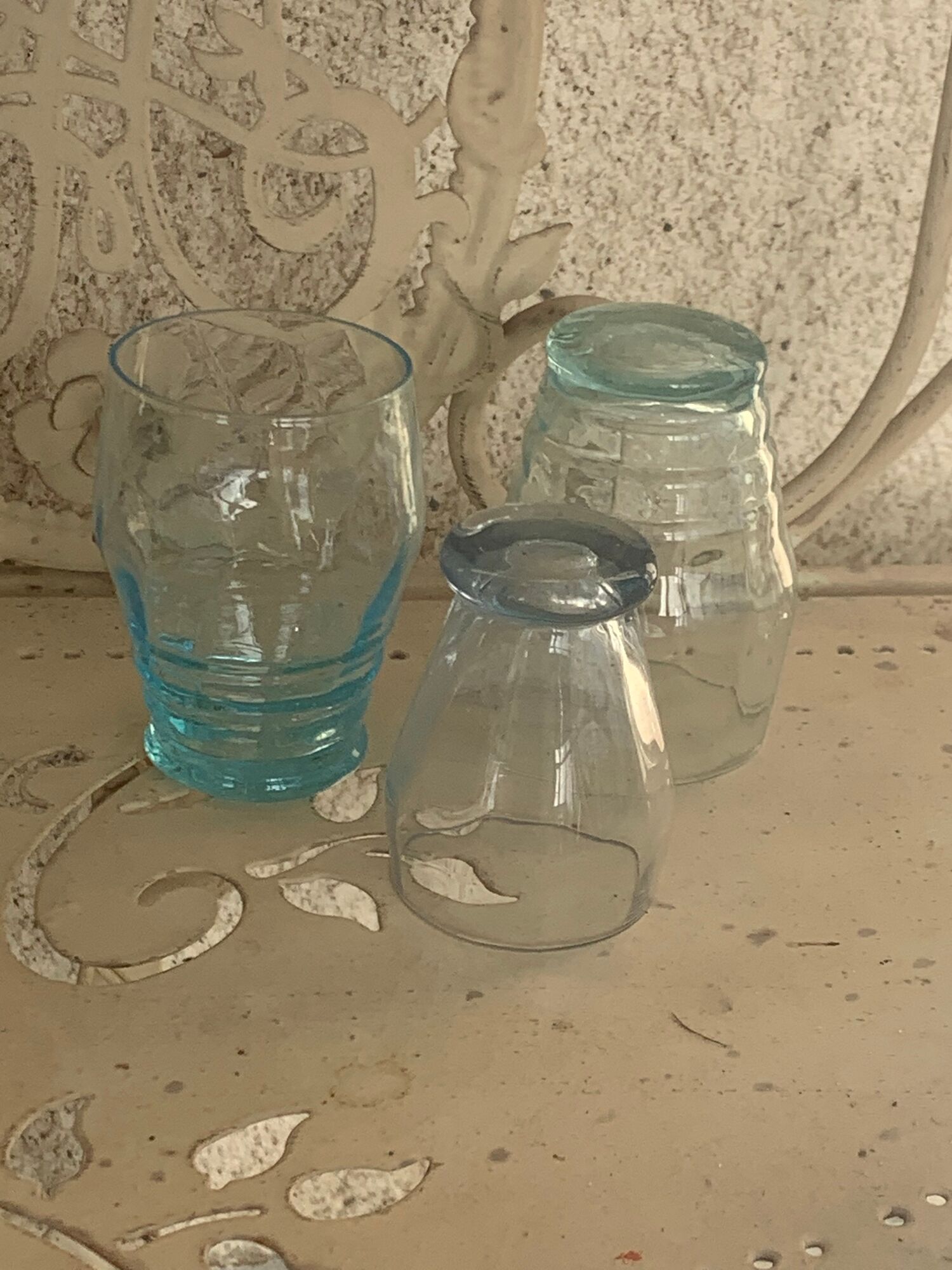 Liquor service consisting of a blue glass decanter and. 3 small antique glasses