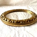 Small vintage wall mirror in gold resin