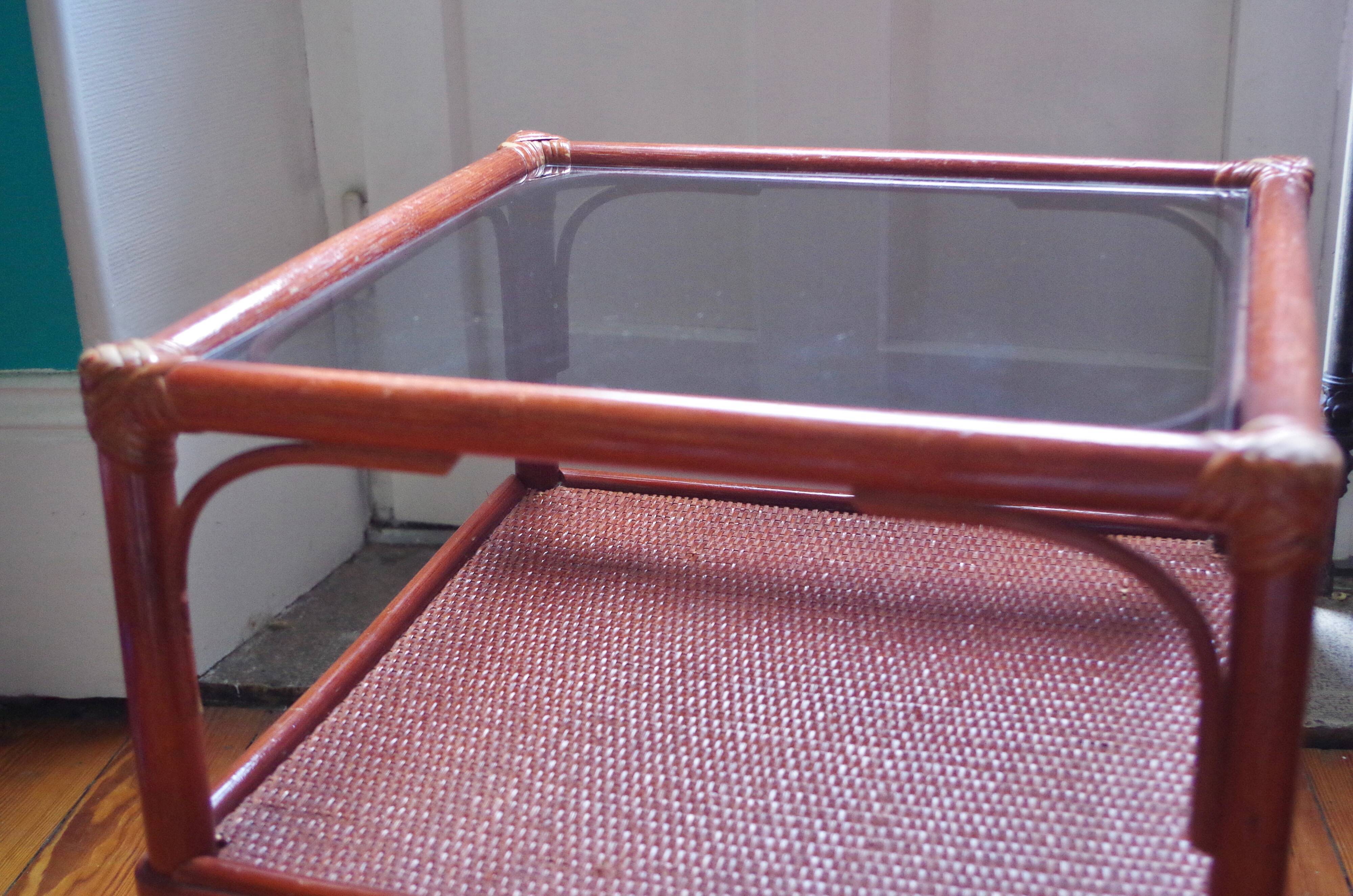 Varnished rattan coffee table and smoked glass top