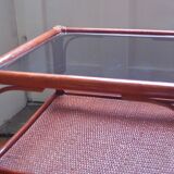 Varnished rattan coffee table and smoked glass top