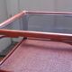 Varnished rattan coffee table and smoked glass top