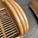 2 rattan and woven wicker armchairs in vintage 70s style