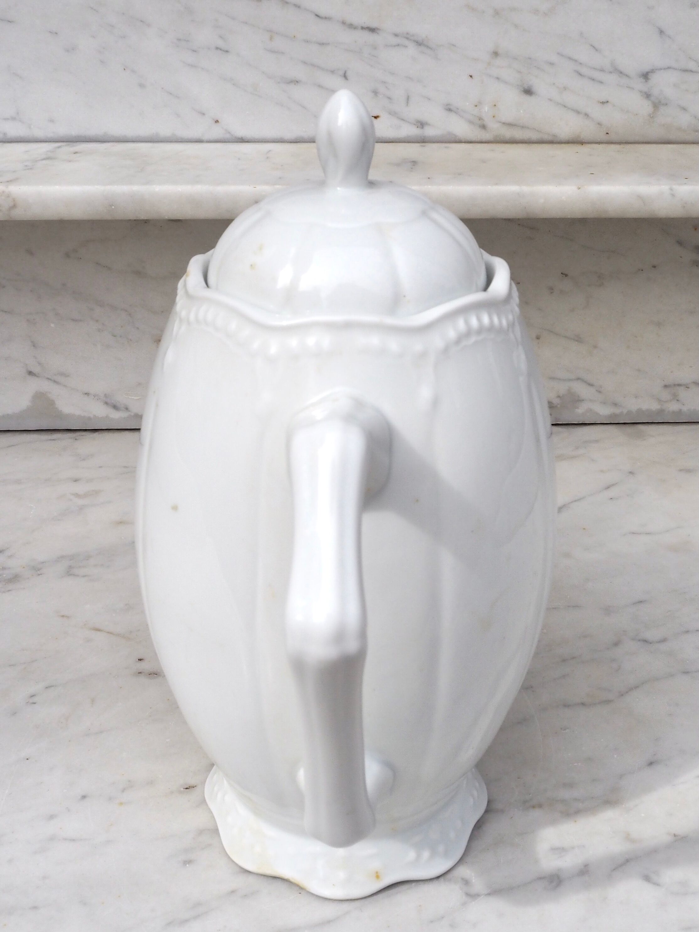 Worked white porcelain coffee maker