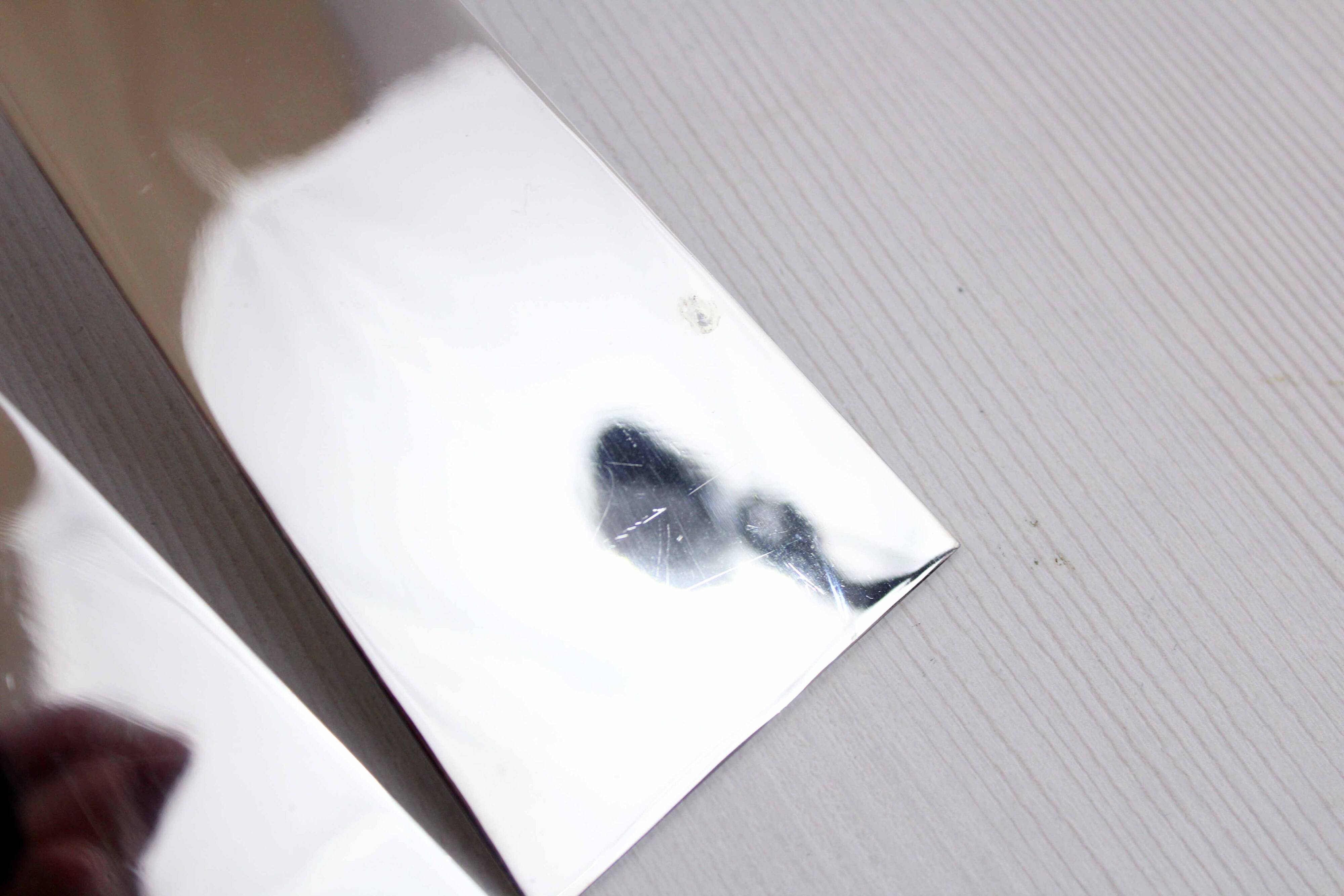 Pair of brass and chrome-plated metal candlesticks