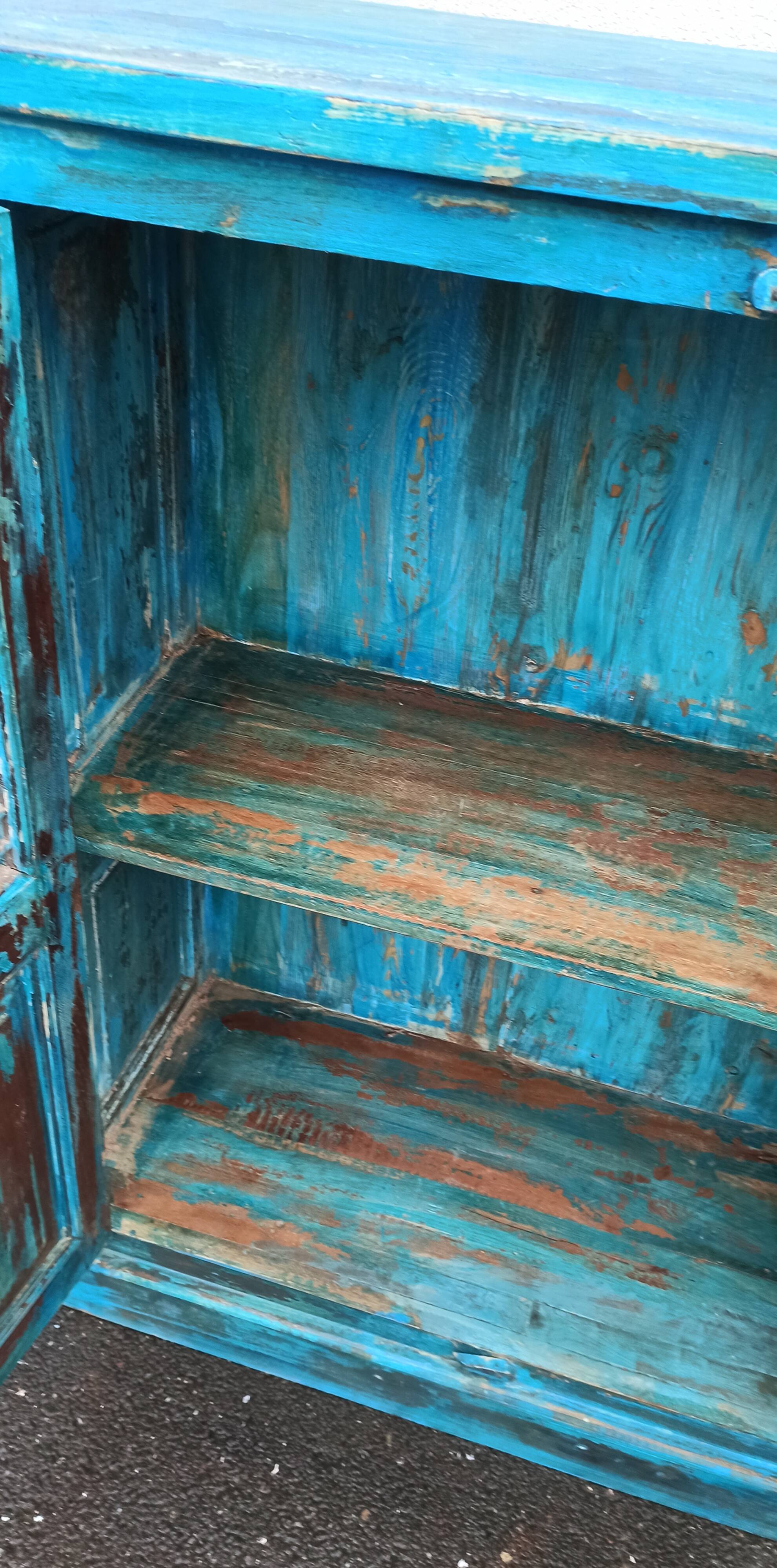 Old wooden cabinet with doors with grille