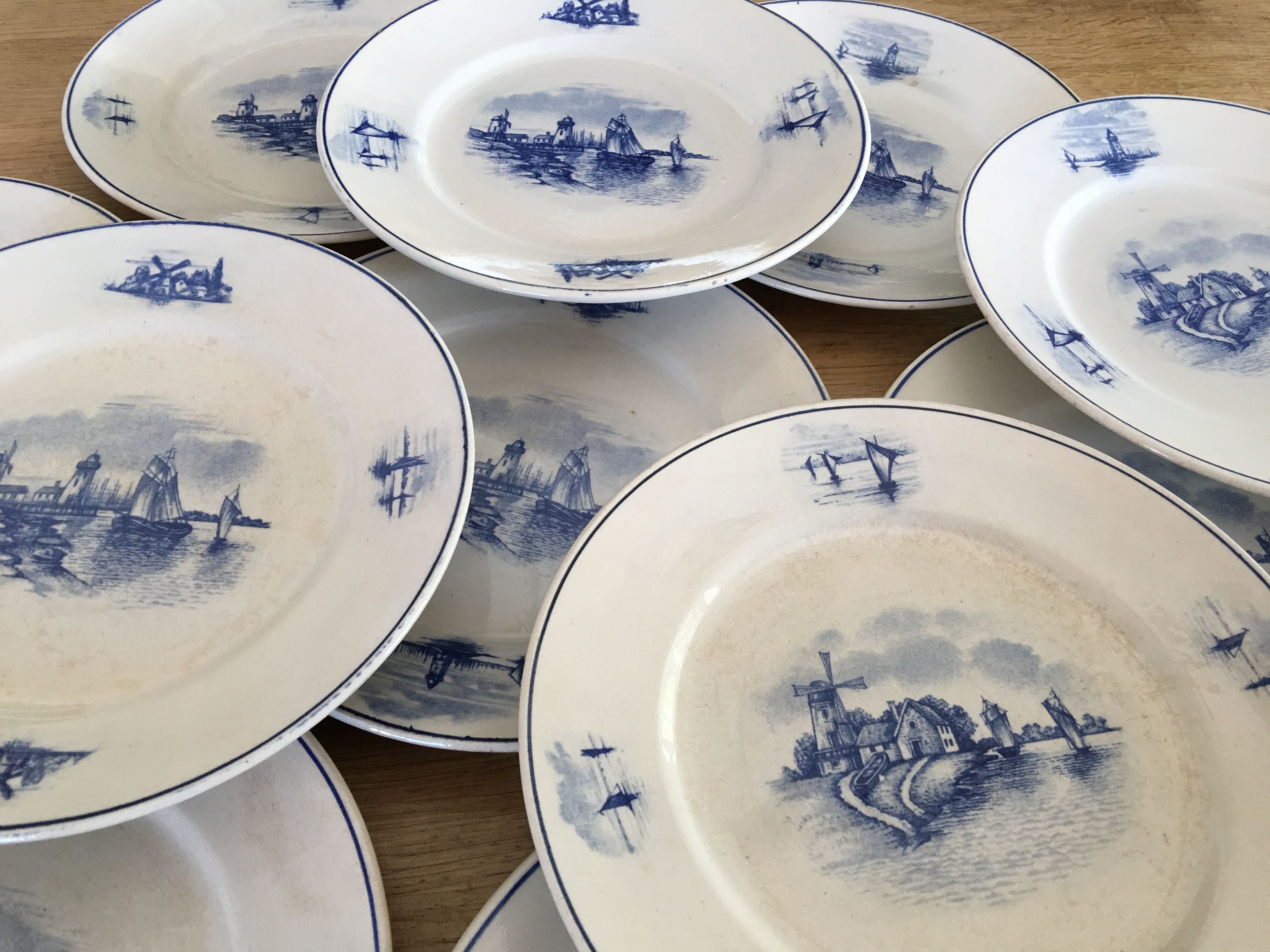 Series of 11 flat plates, Dutch earthenware, early XX