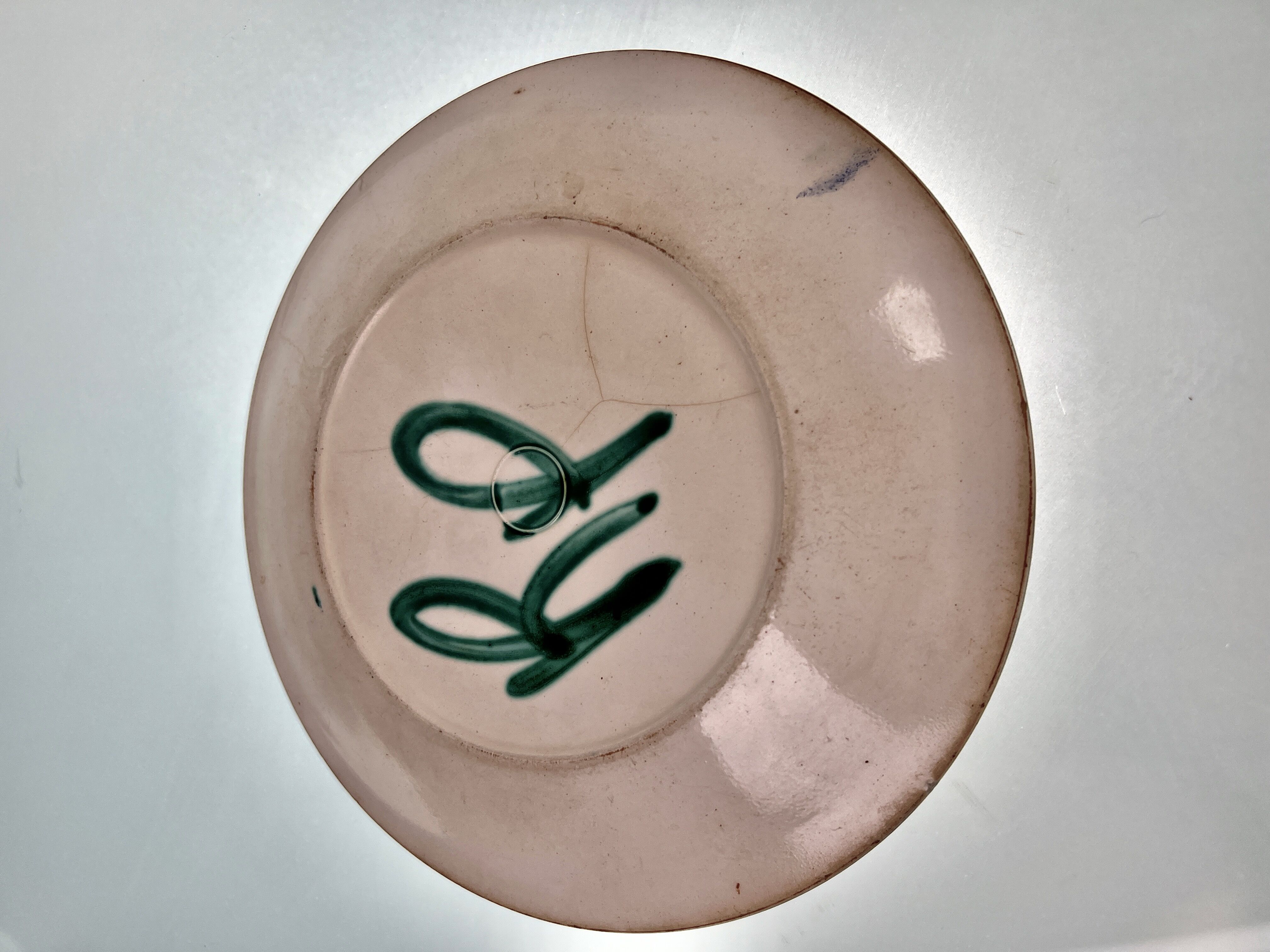 Flat ceramic plate by <Robert Picault