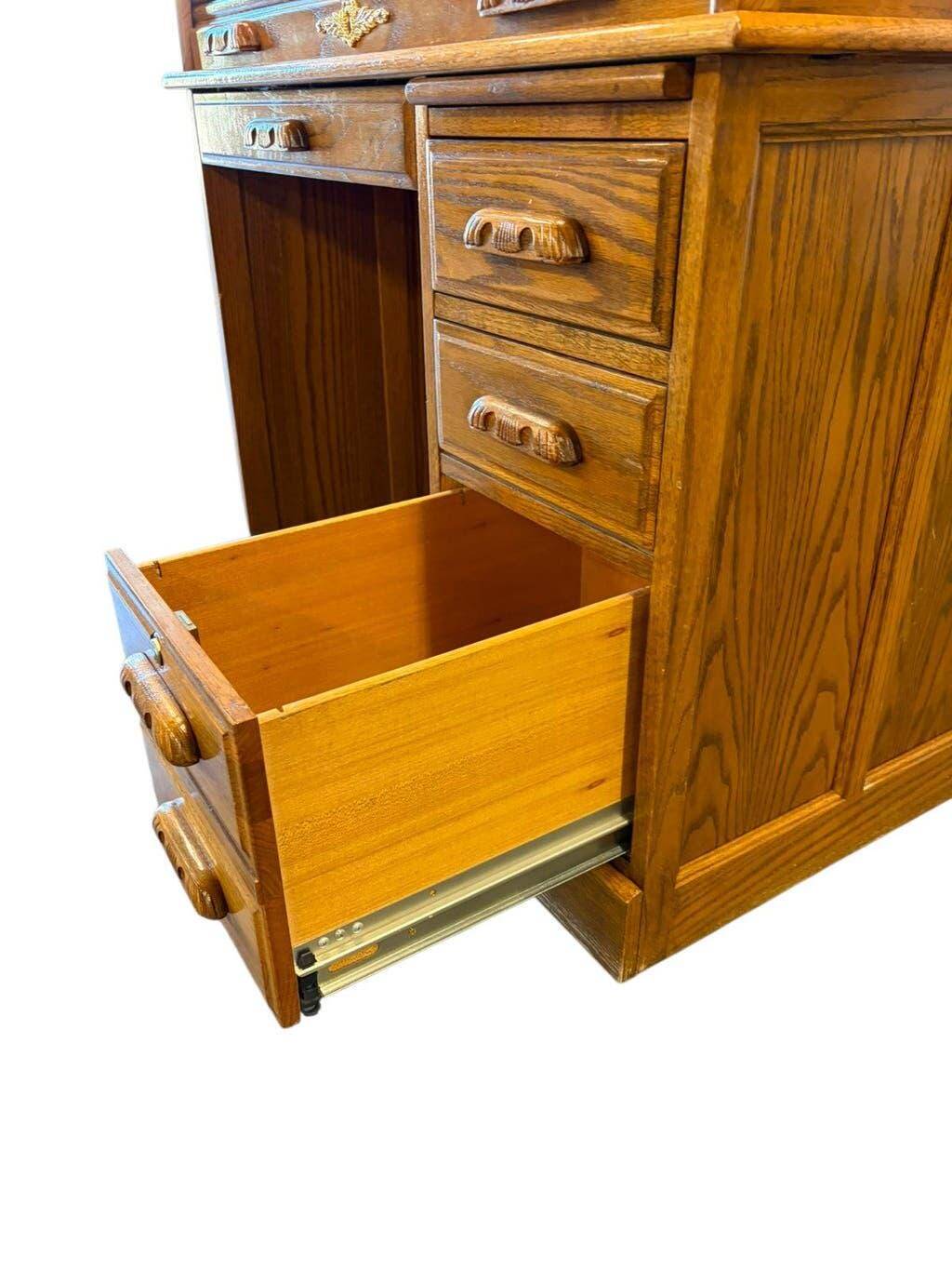Vintage American wooden desk with a roll-top.