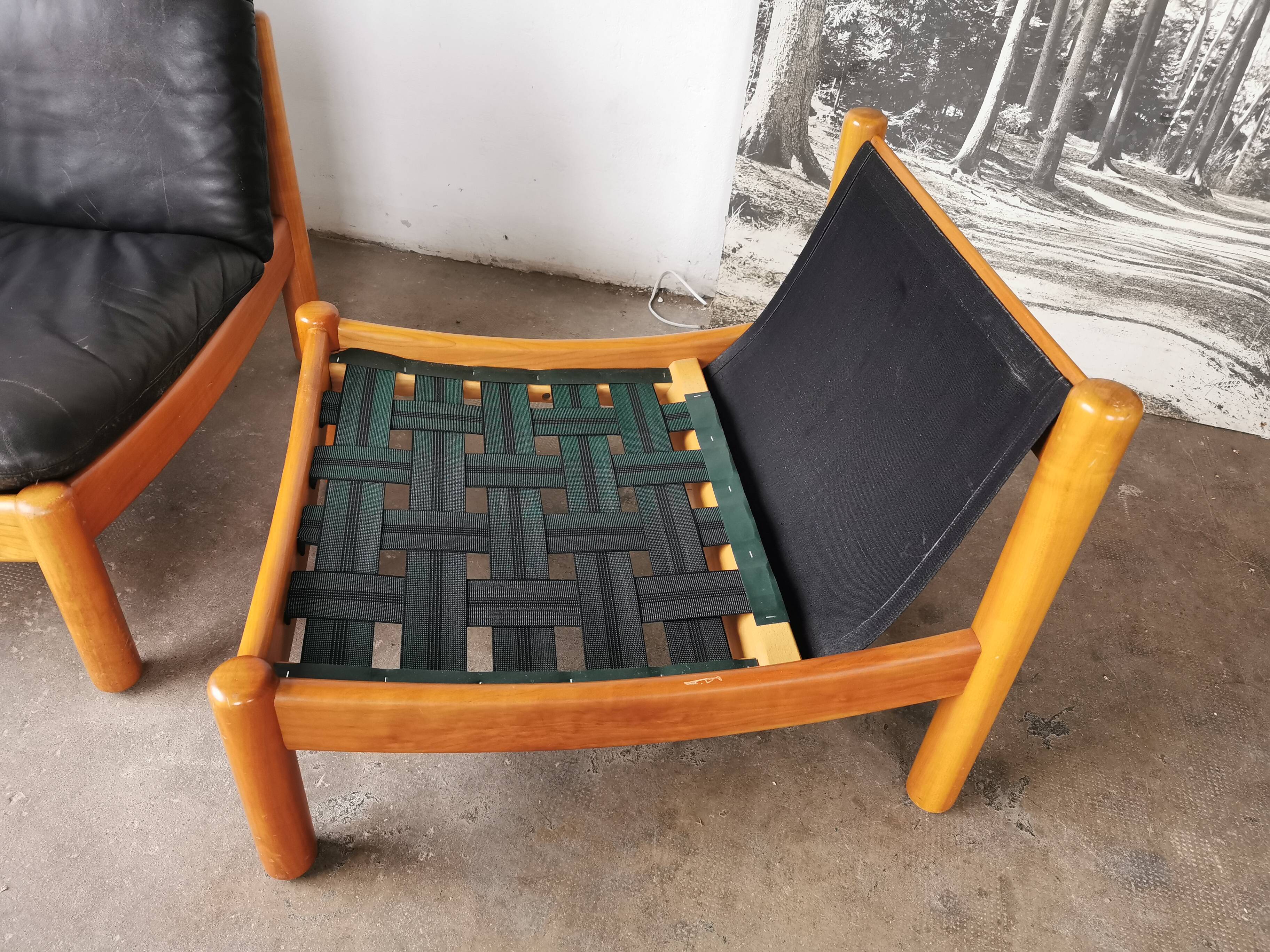 Pair of designer leather armchairs 80s