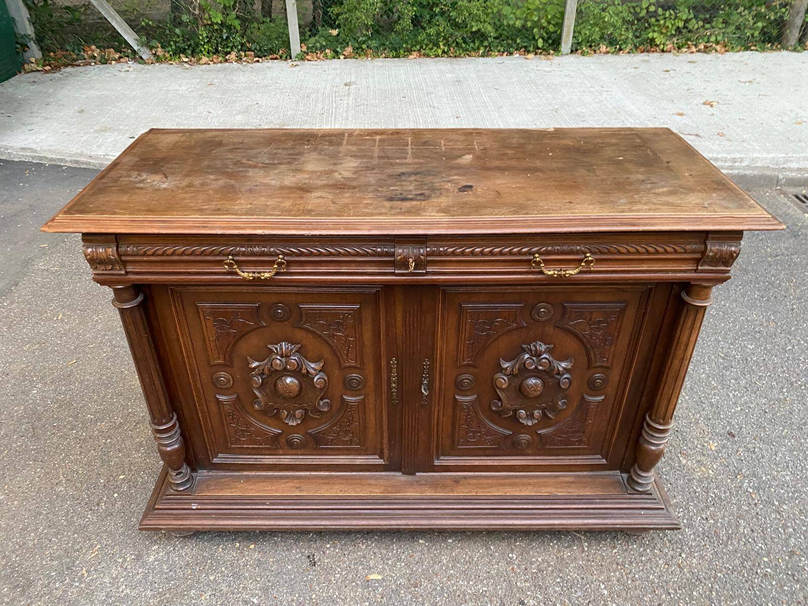 Henri II sideboard in carved wood, 1930.