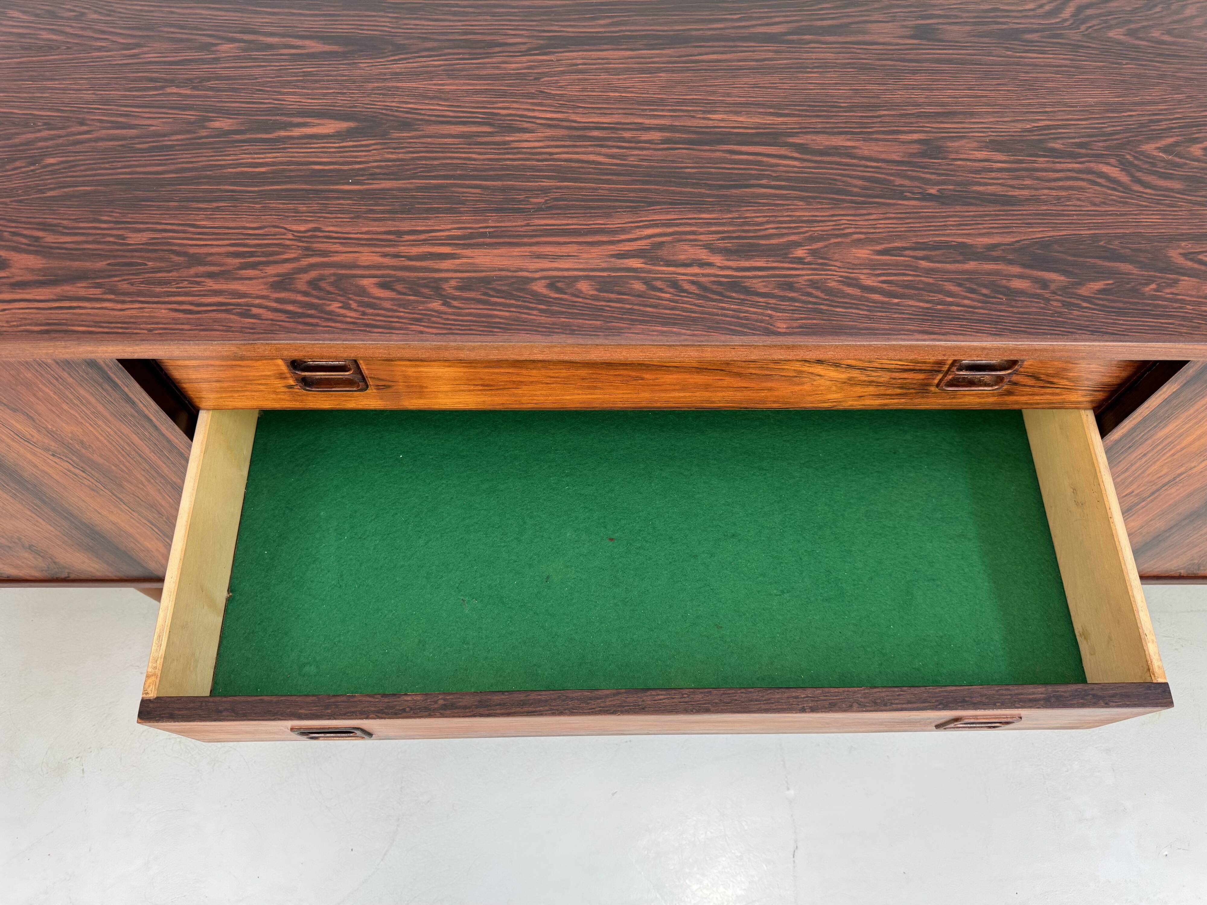 Danish rosewood vintage sideboard with sliding teak doors from the 1960s
