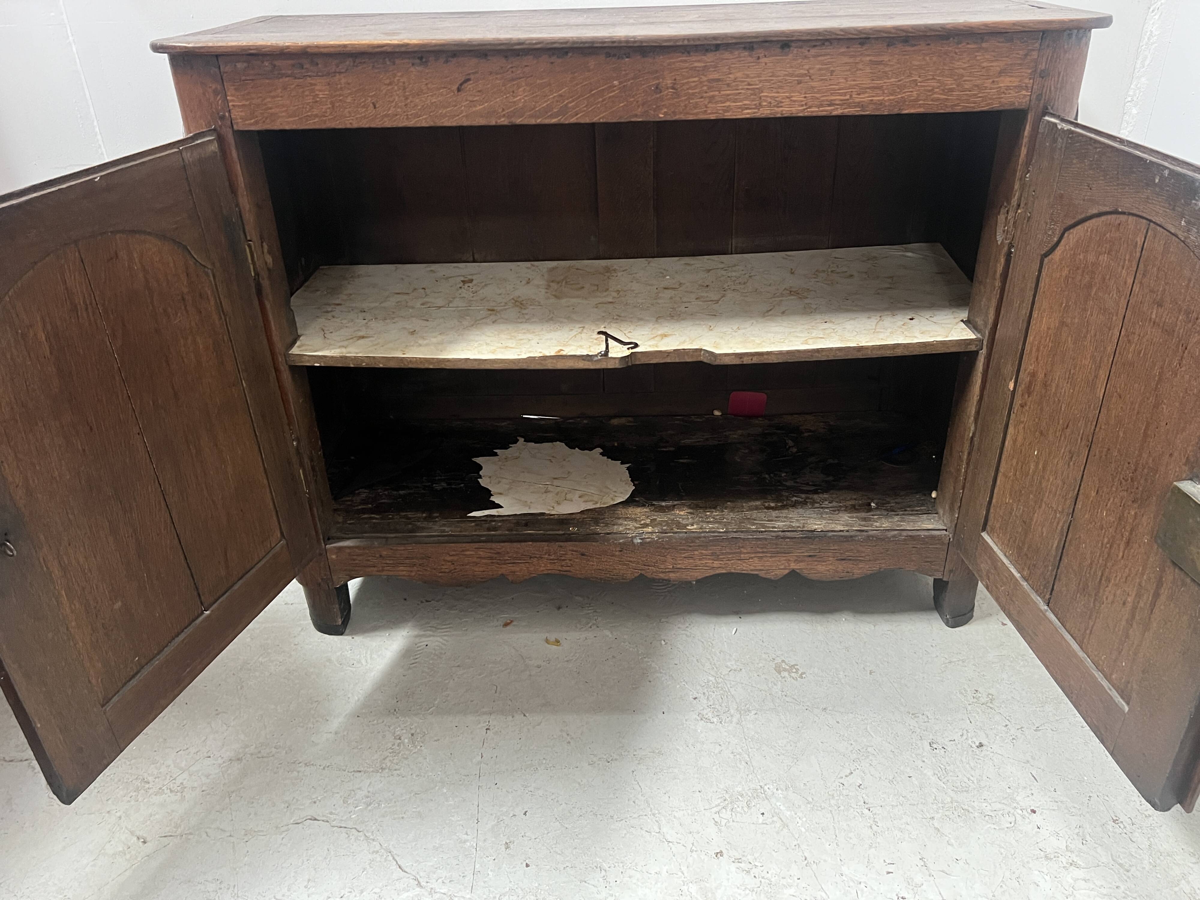 Two-door buffet in solid oak, Louis XIV style, 18th century.