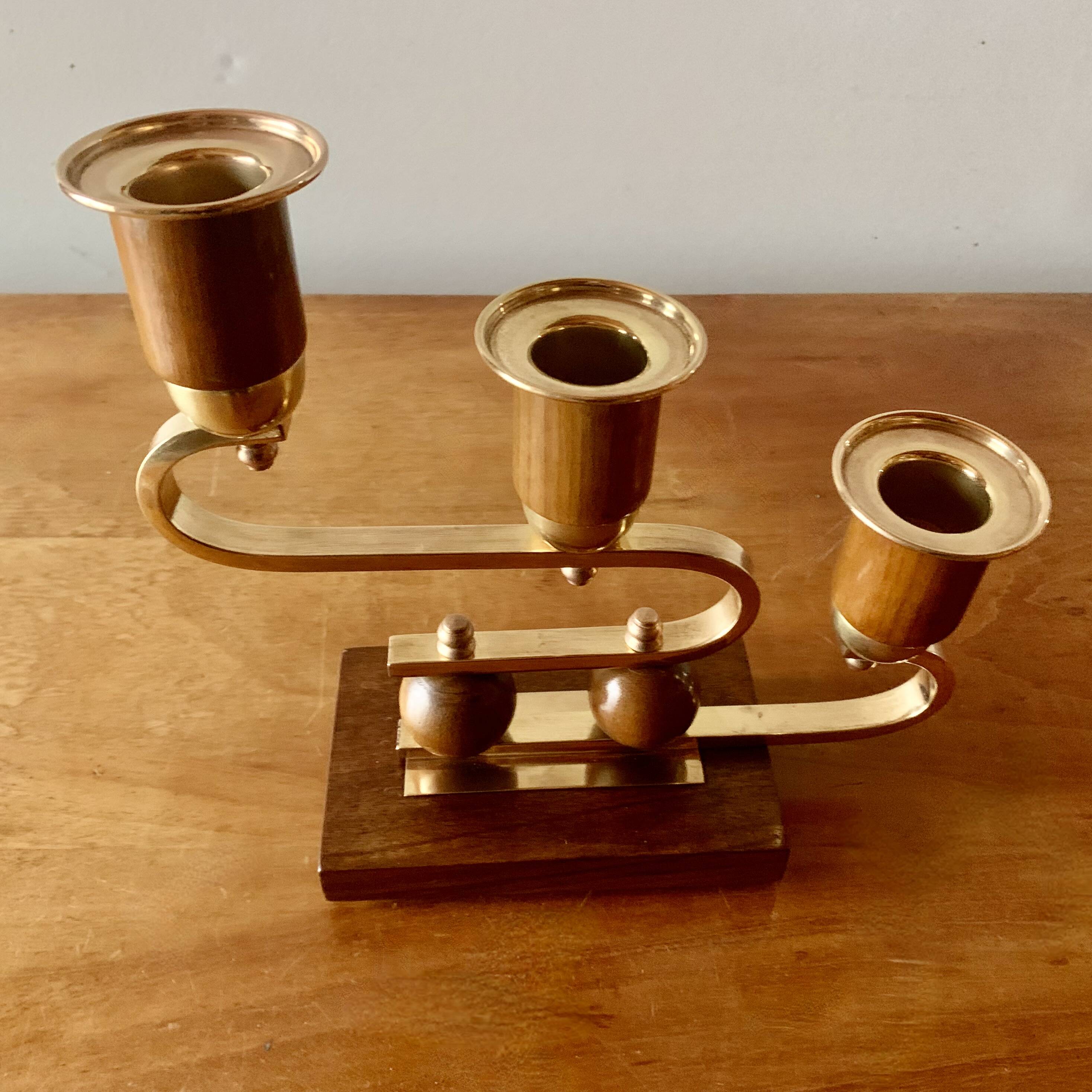 Pair of Art Deco candlesticks in gilded brass and wood