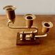 Pair of Art Deco candlesticks in gilded brass and wood