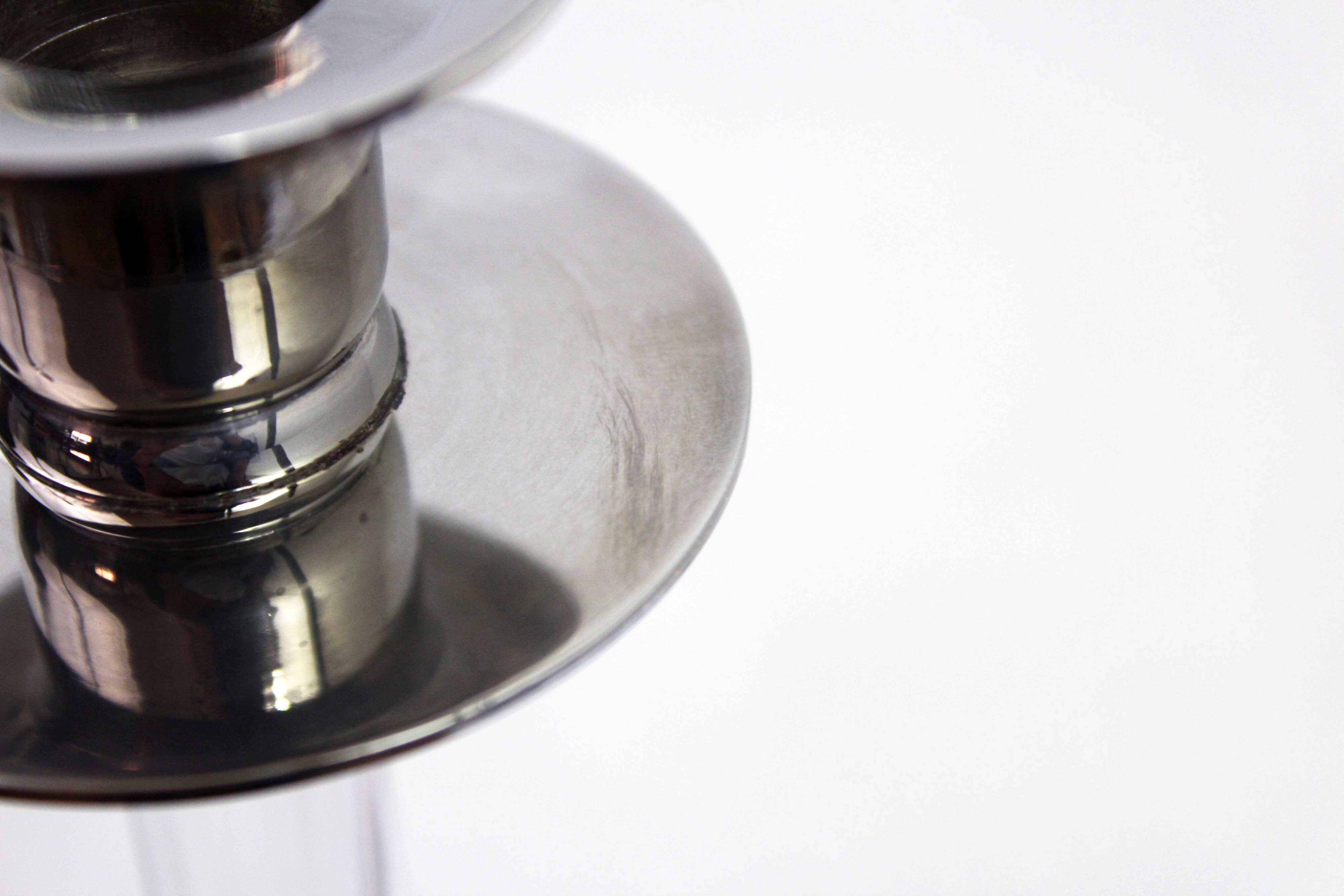 Pair of lucite and silver-plated metal candlesticks
