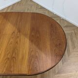 Round and extendable dining table published by G-Plan