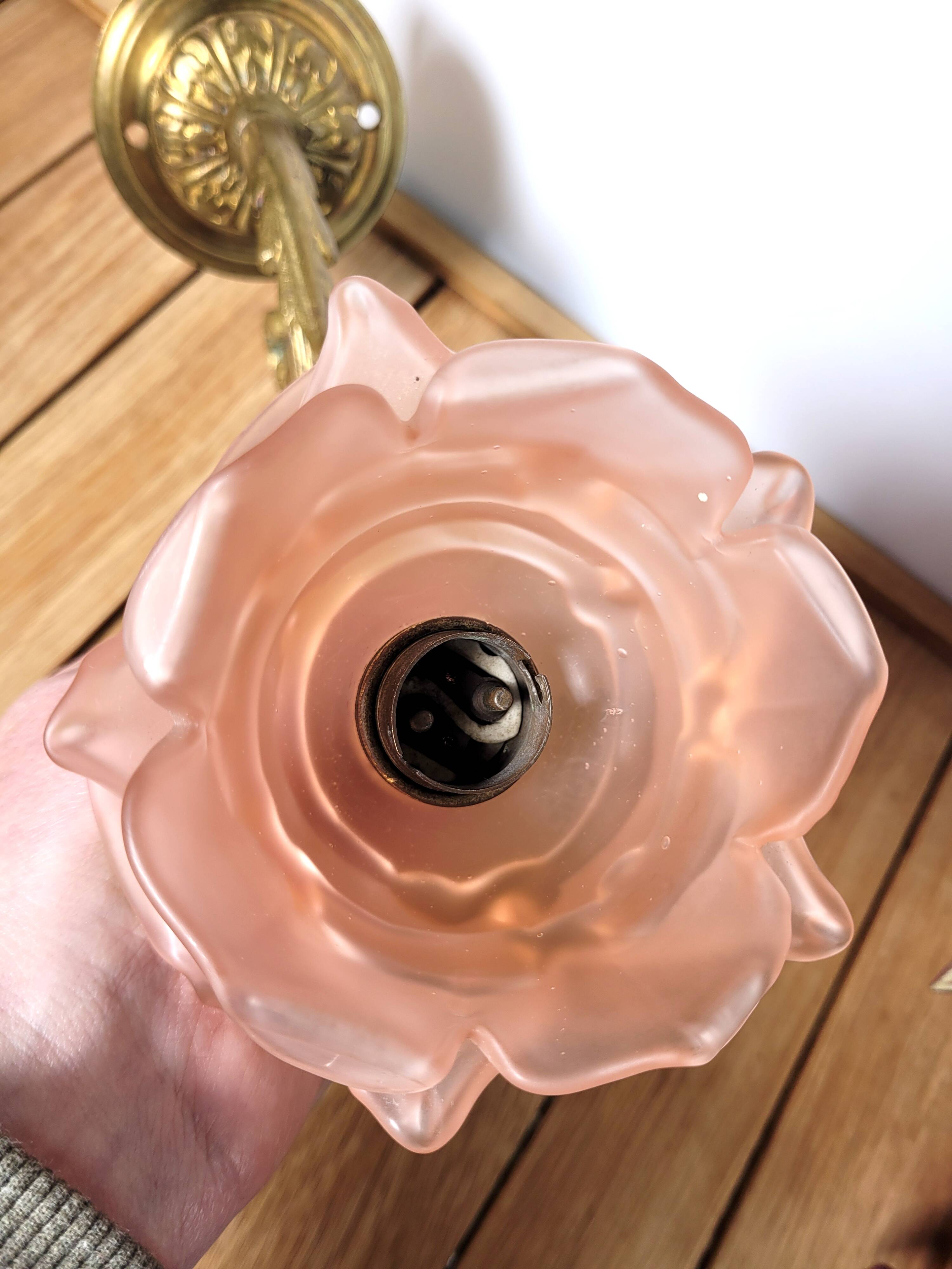 Old pink and golden brass wall lamp