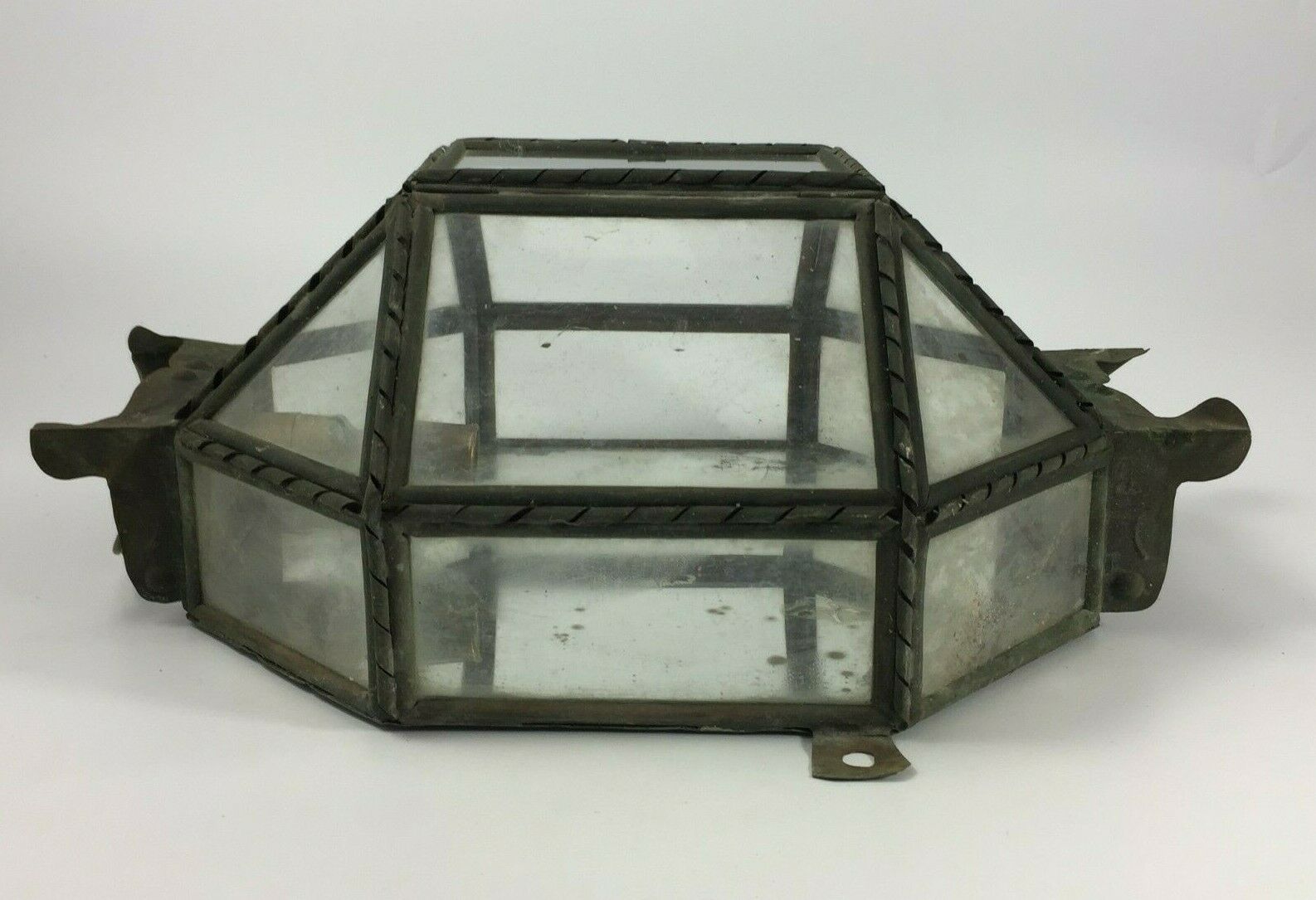 Metal and brass wall light with mirror background 1900