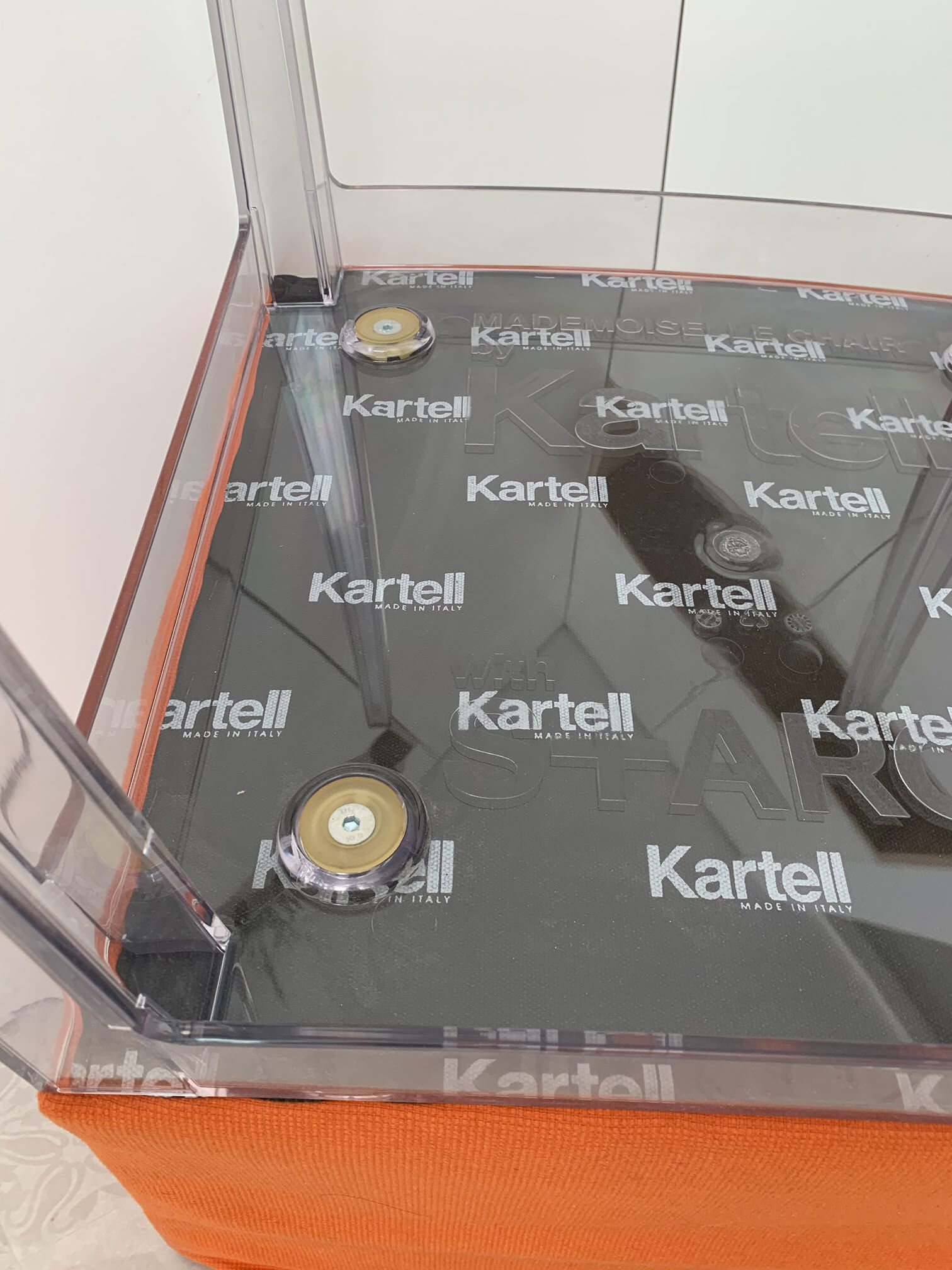 Kartell Mademoiselle Uni Orange chair by Philippe Starck