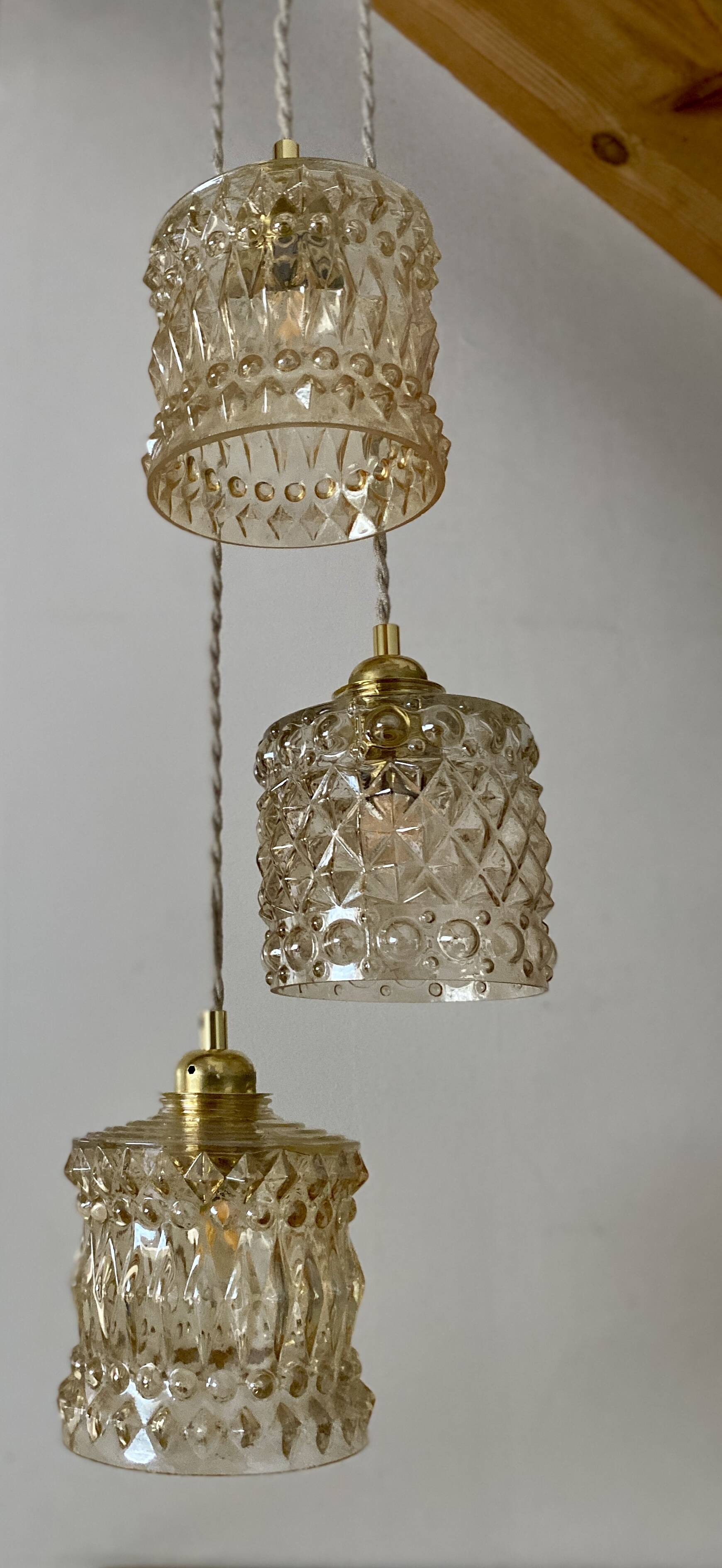 Triple antique globe pendant light in amber glass