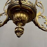 Renaissance chandelier with putti statuette.