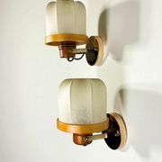 Pair of articulated "Cocoon" wall lights, resin and pine, Italy, circa 1970s