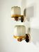 Pair of articulated "Cocoon" wall lights, resin and pine, Italy, circa 1970s