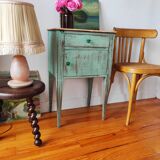Patinated bedside table end of sofa