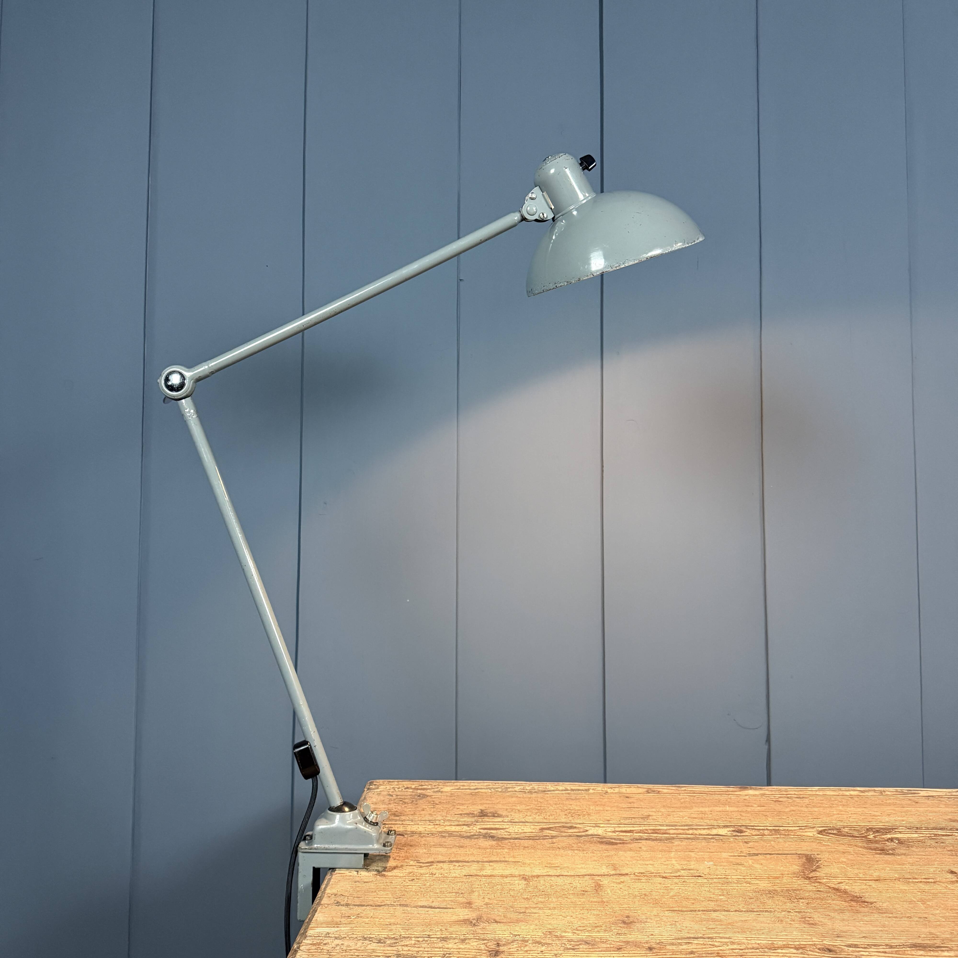 Grey two-arm Kaiser Idell clamp lamp model
