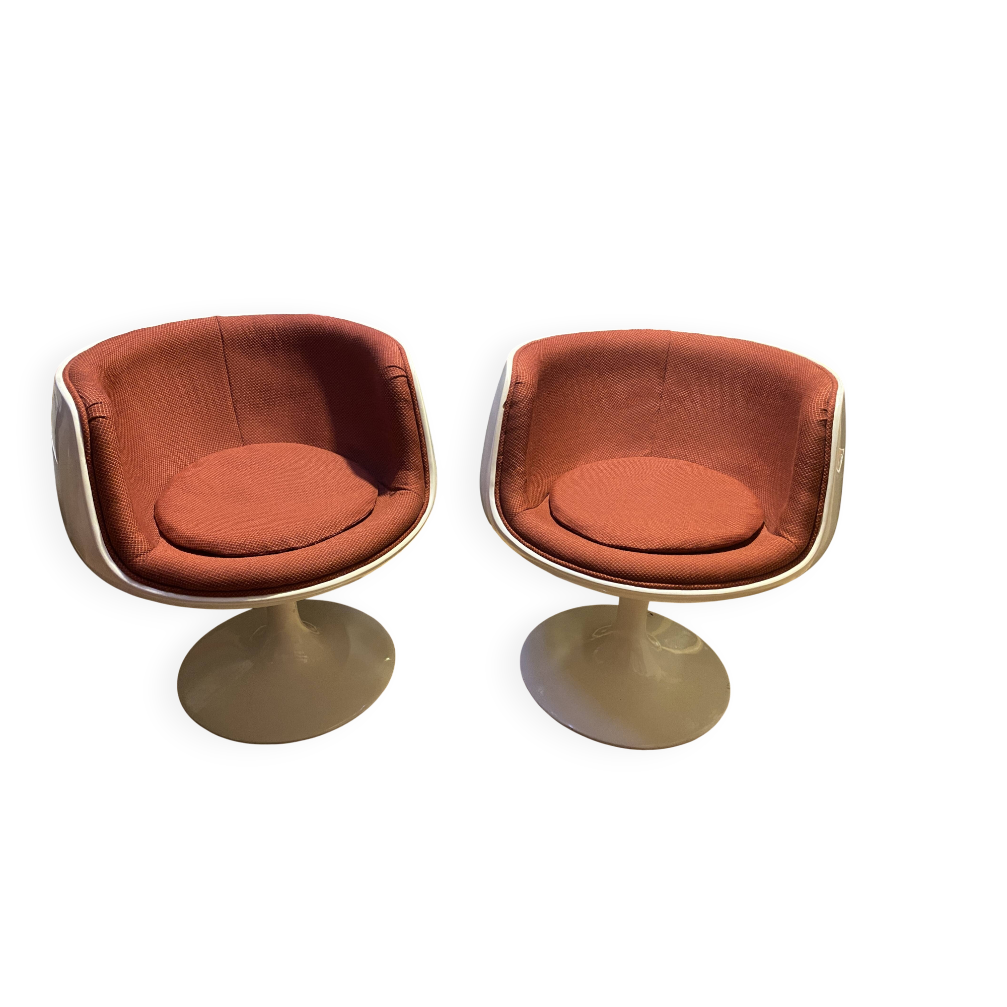 Two cognac-colored swivel chairs made of fiberglass from the 1970s
