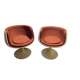 Two cognac-colored swivel chairs made of fiberglass from the 1970s