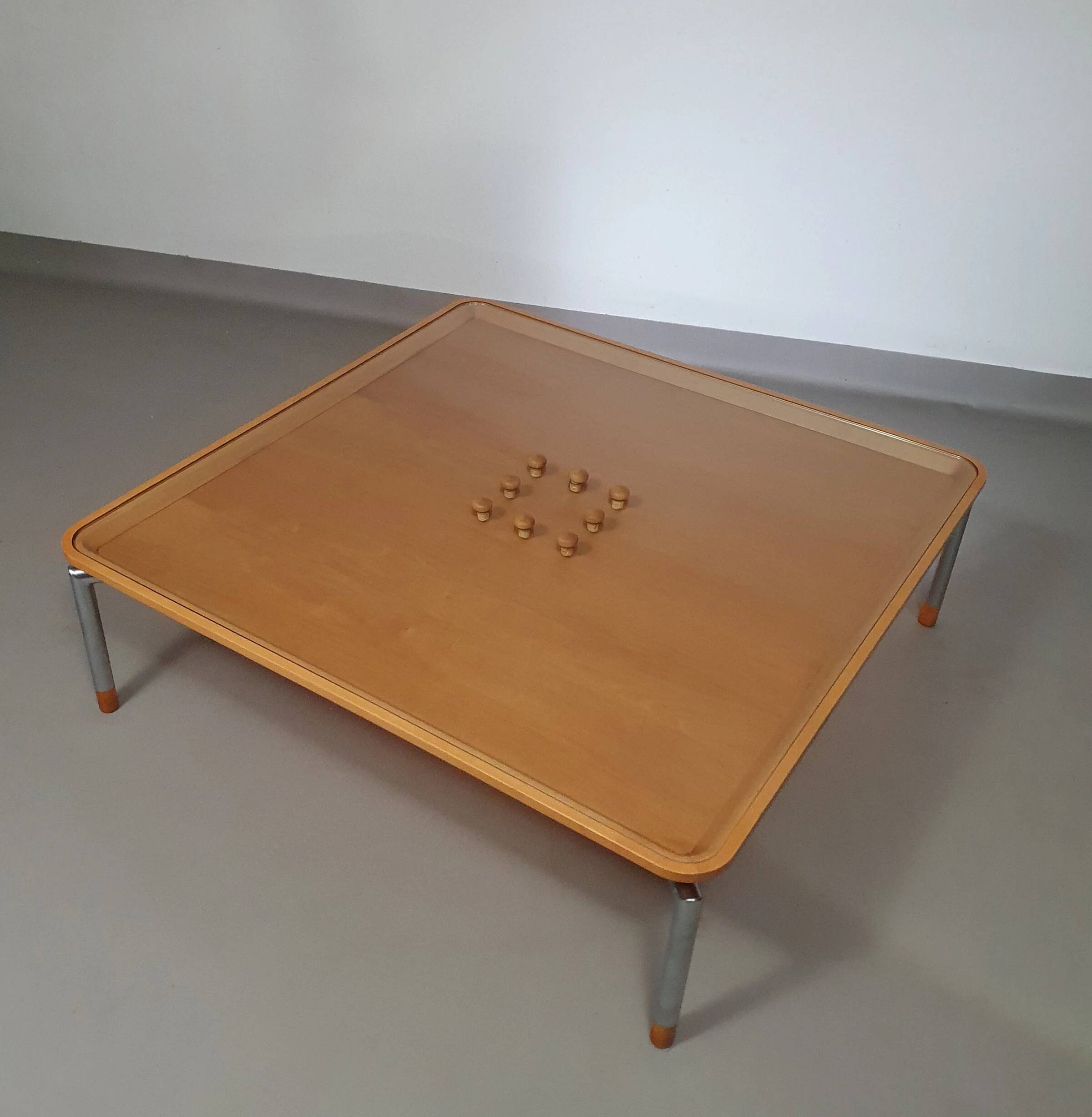 Rare coffee table 110 x 110 x height 35 cm with 8 flange wooden / cork caps in the glass top.