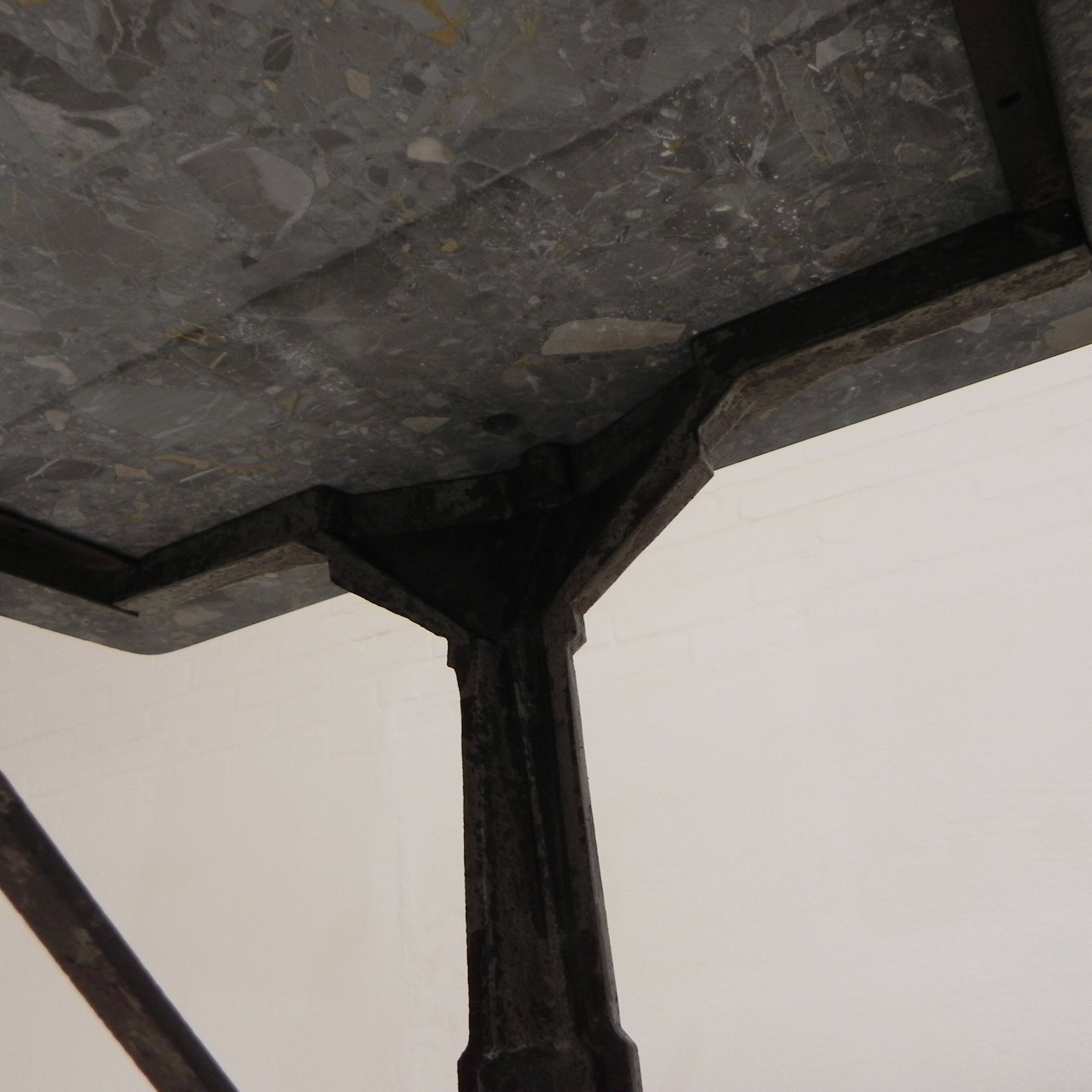Bistro table with a marble top on a cast iron frame, 1930s.