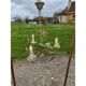 Vintage gold metal chandelier with floral decoration.