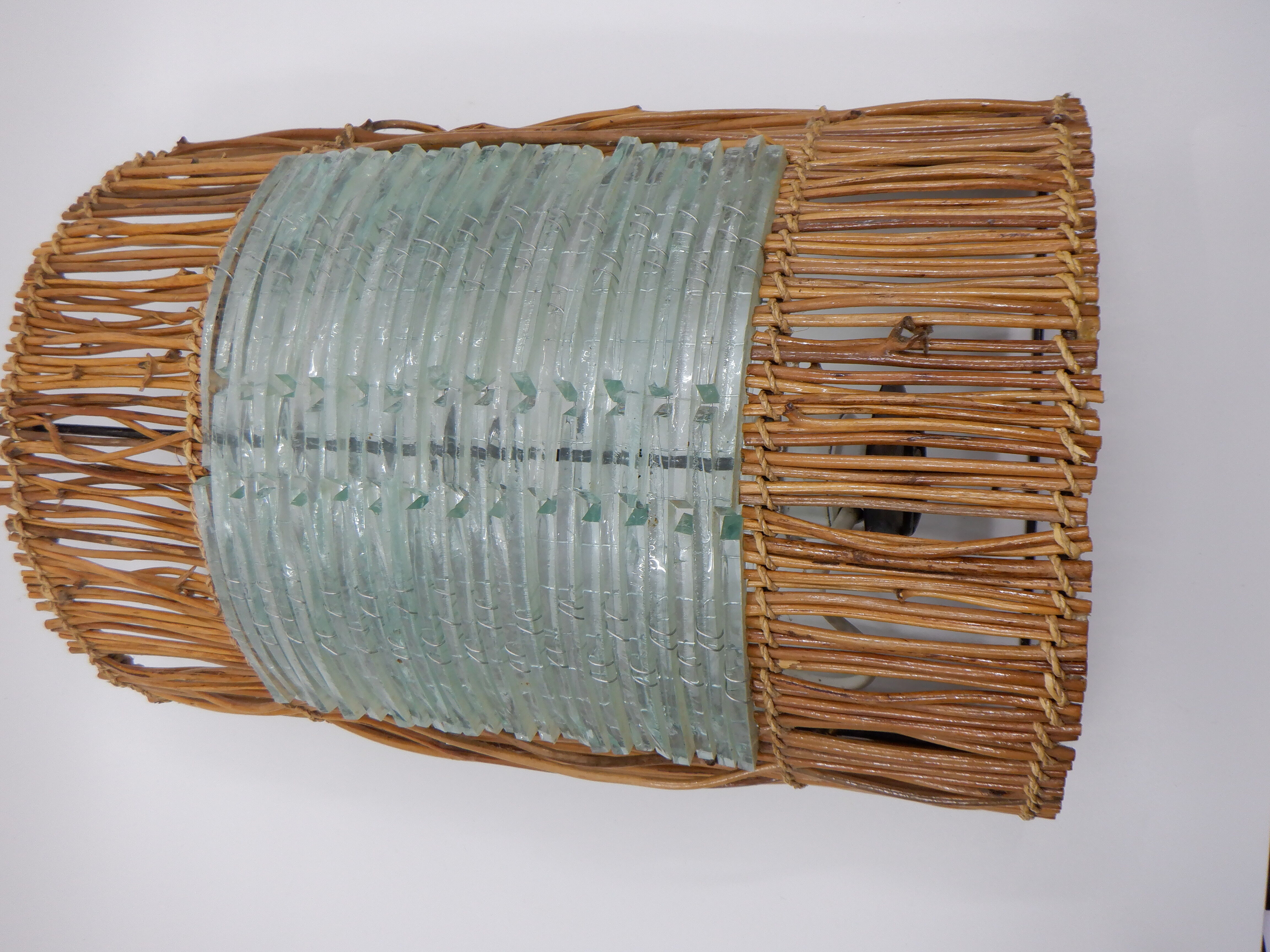 Glass and rattan sconce