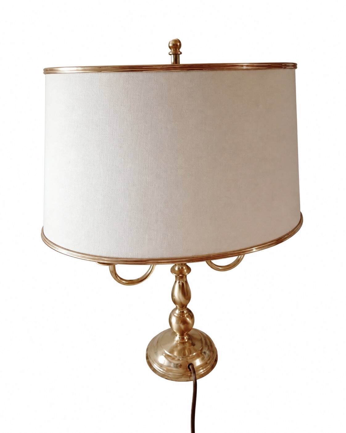 Empire style brass bouillotte lamp with an ivory oval shade.