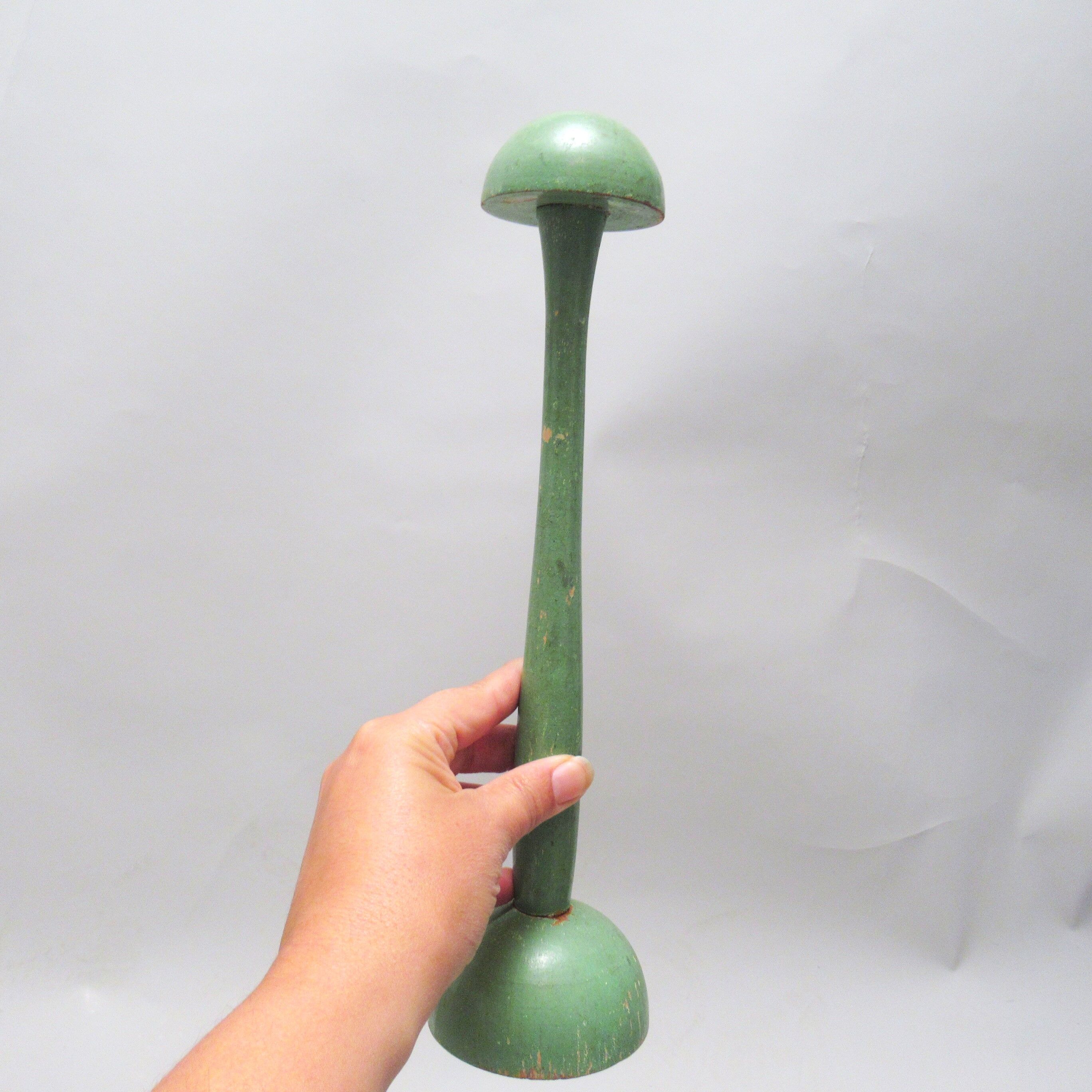 Green wooden hat holder